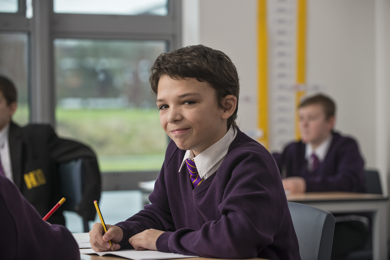 Image of pupil engaged in written work